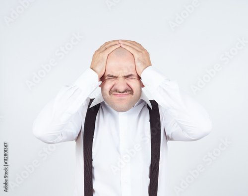 man holding his head pain.