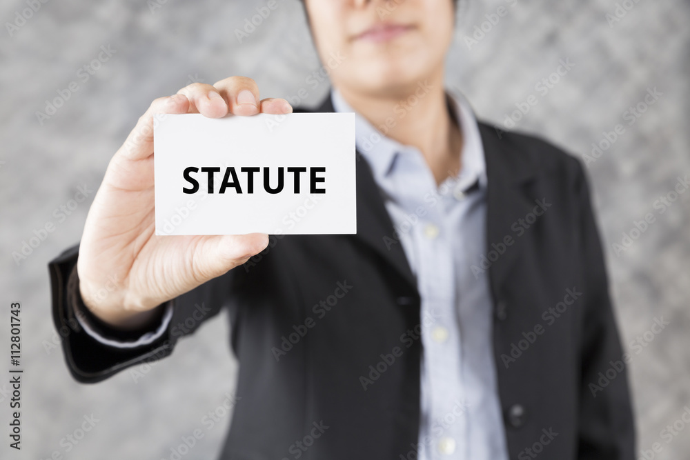 businessman presenting business card with word statute businessman presenting business card with word statute