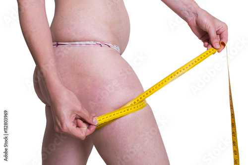 fat woman measuring her leg