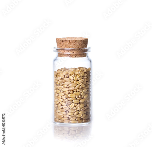 organic oat rice in transparent glass bottle  
