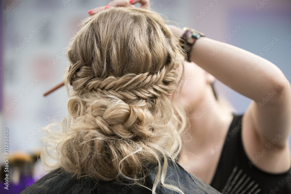 Naklejka premium Application of wedding makeup. Preparation of the bride. Boho style. Ease of braided hair braids.