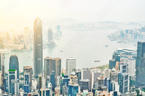 Business concept for real estate and corporate construction - panoramic modern city skyline bird eye aerial view with dramatic sunrise and morning blue sky in Hong Kong (HK), China