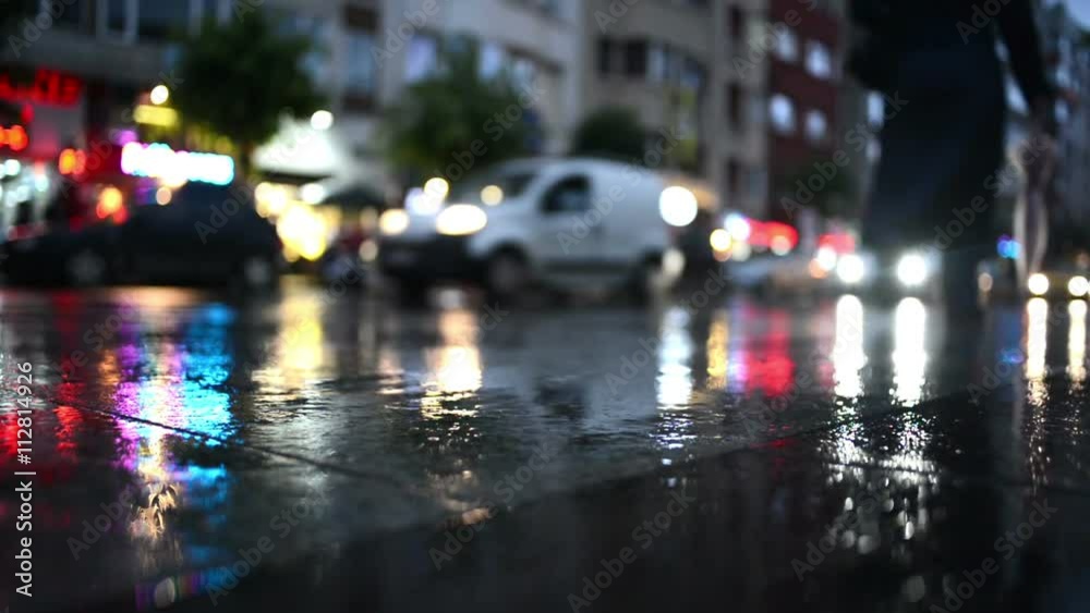 People are walking on the street after rain in Istanbul, Turkey.