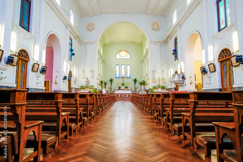 The interior view of traditional church with empty bench and aisle, the famous heritage in Macao/Macau, China