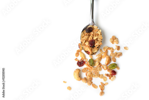 Homemade granola with honey, oatmeal, cashew nut, almond, pistachio, raisin and cranberry on white background