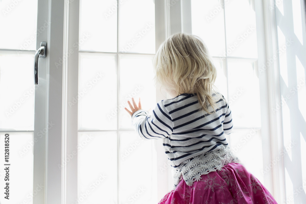 Young Girl Playing Dressing Up Game Looking Out Of Window Young Girl Playing Dressing Up Game Looking Out Of Window
