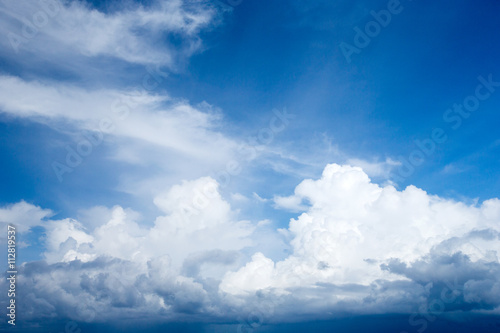 Blue sky background with tiny clouds © Pakhnyushchyy