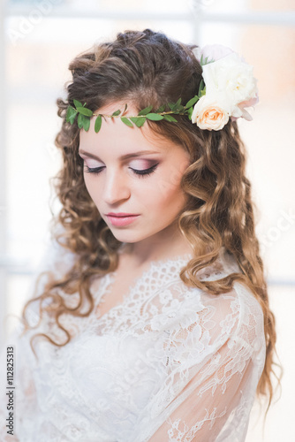 Portrait of a beautiful bride in her hair flower