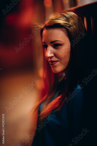 beautiful girl in a blue dress against the backdrop of the city at night
