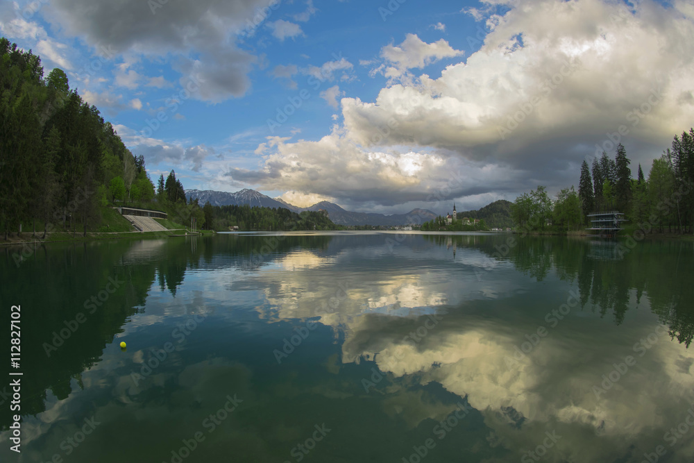Fototapeta premium Clouds reflecting in the lake, Bled Slovenia