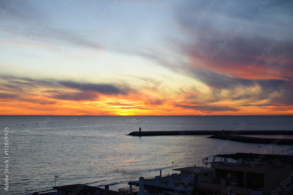Fototapeta premium Dawn over the ocean, colorful sky background