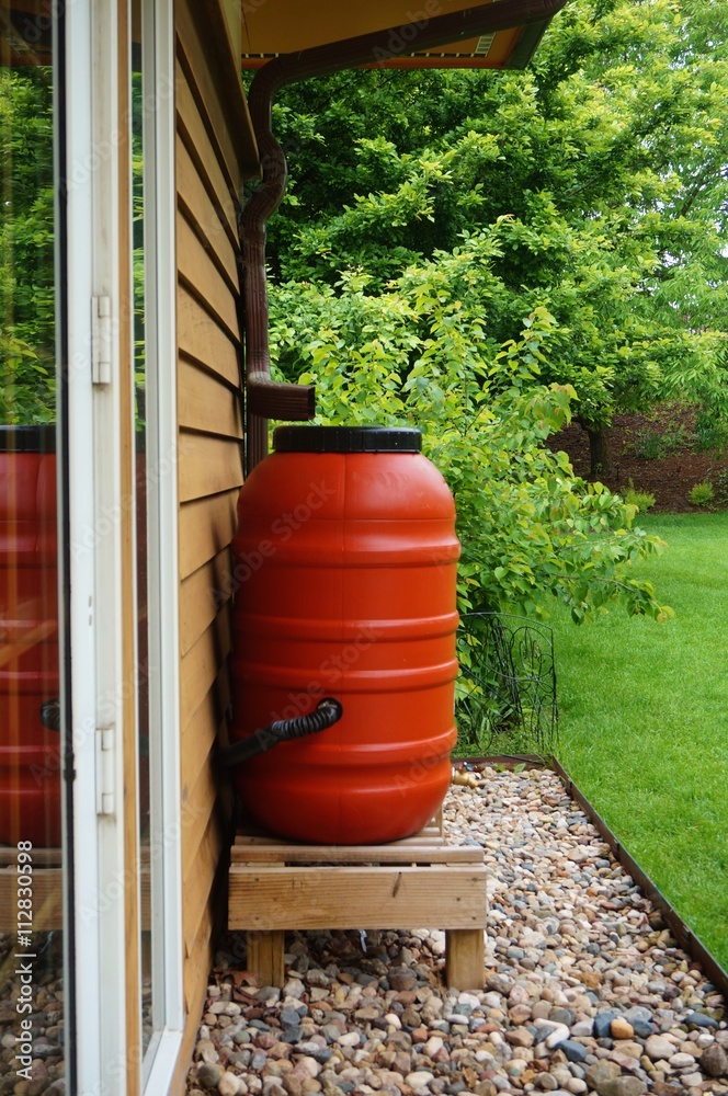 Rain barrels collecting water in the garden Rain barrels collecting water in the garden