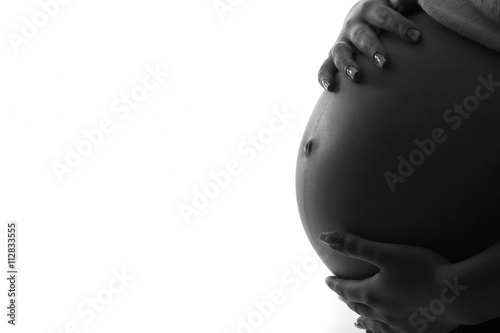 pregnant woman holding her belly 