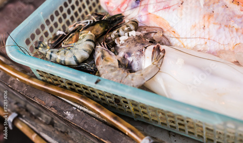 Seafood on ice at the fish market photo