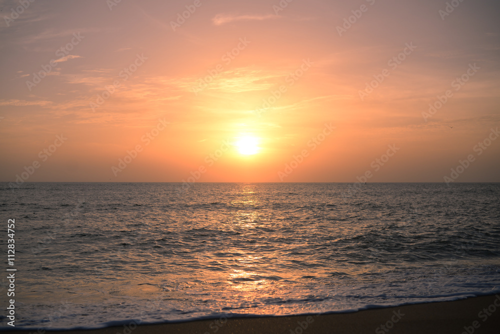 Dawn over the ocean, colorful sky background