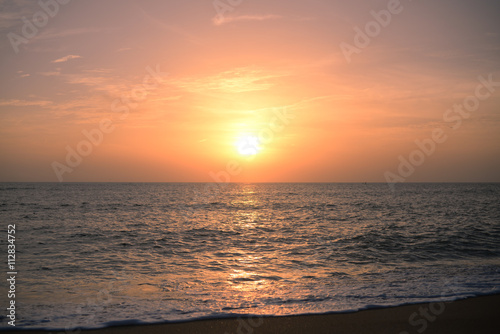 Dawn over the ocean, colorful sky background