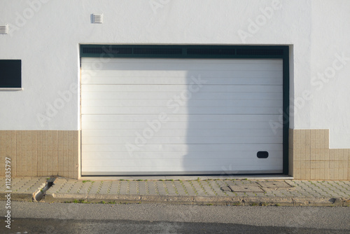 Background closed garage gate in modern building