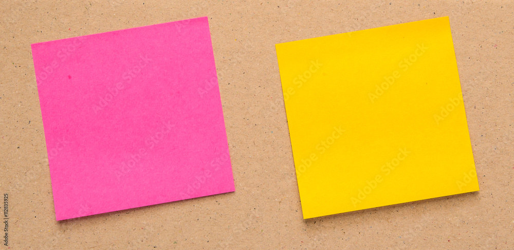 Yellow,Pink paper labels square on Brown cardboard. Yellow,Pink paper labels square on Brown cardboard.