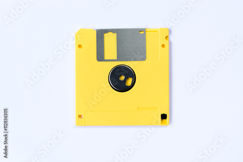 yellow colorful floppy disk or diskette isolated on white backgr