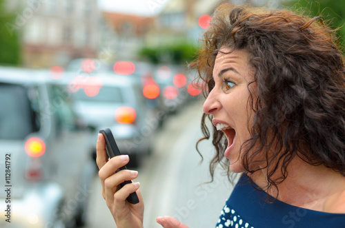 Aghast young woman with a horrified expression