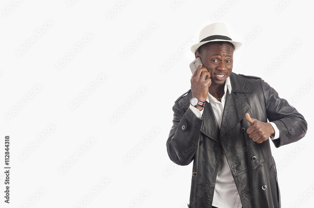 Young african american man using a mobile phone 