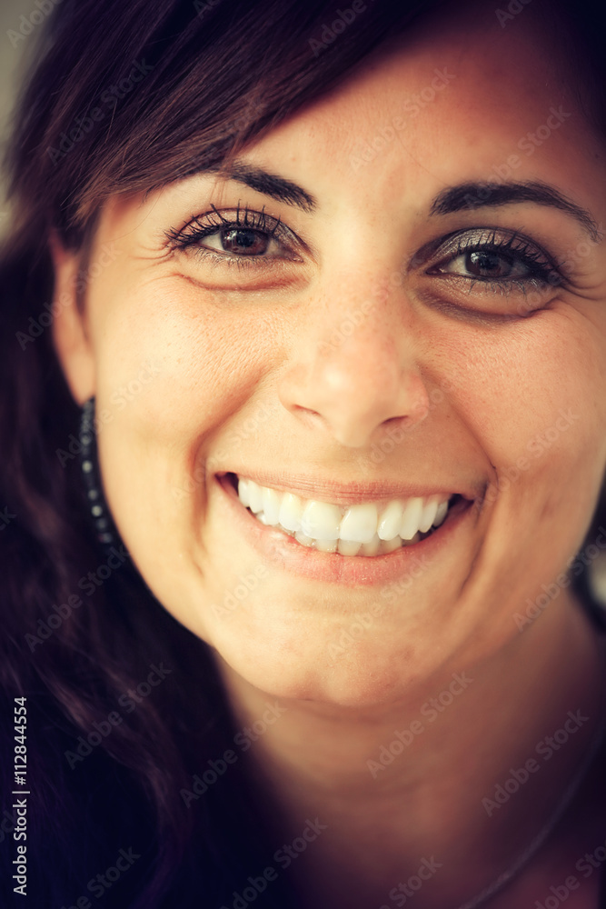 Close up portrait of a young woman smiling Close up portrait of a young woman smiling