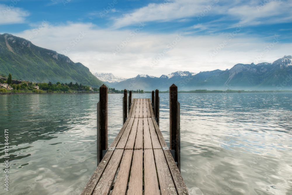 Switzerland landscape - Wooden pier in lake at Switzerland. Beau