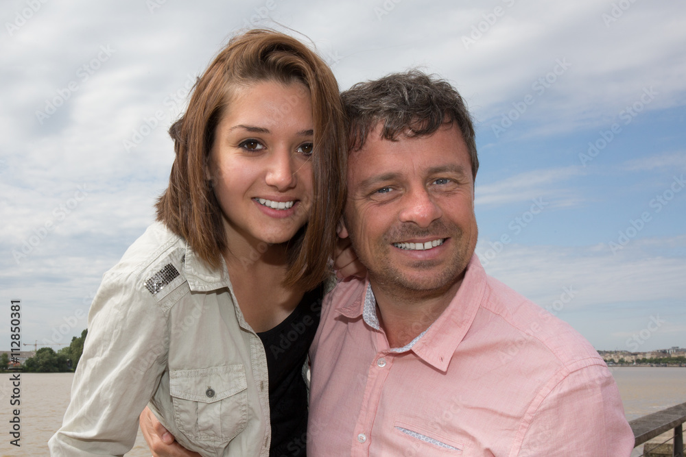 Portrait Of Smiling Couple near to the river on vacation tourism Portrait Of Smiling Couple near to the river on vacation tourism
