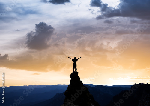 man on the top of a rock © Kotangens