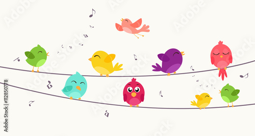 Colorful birds sitting on wire 