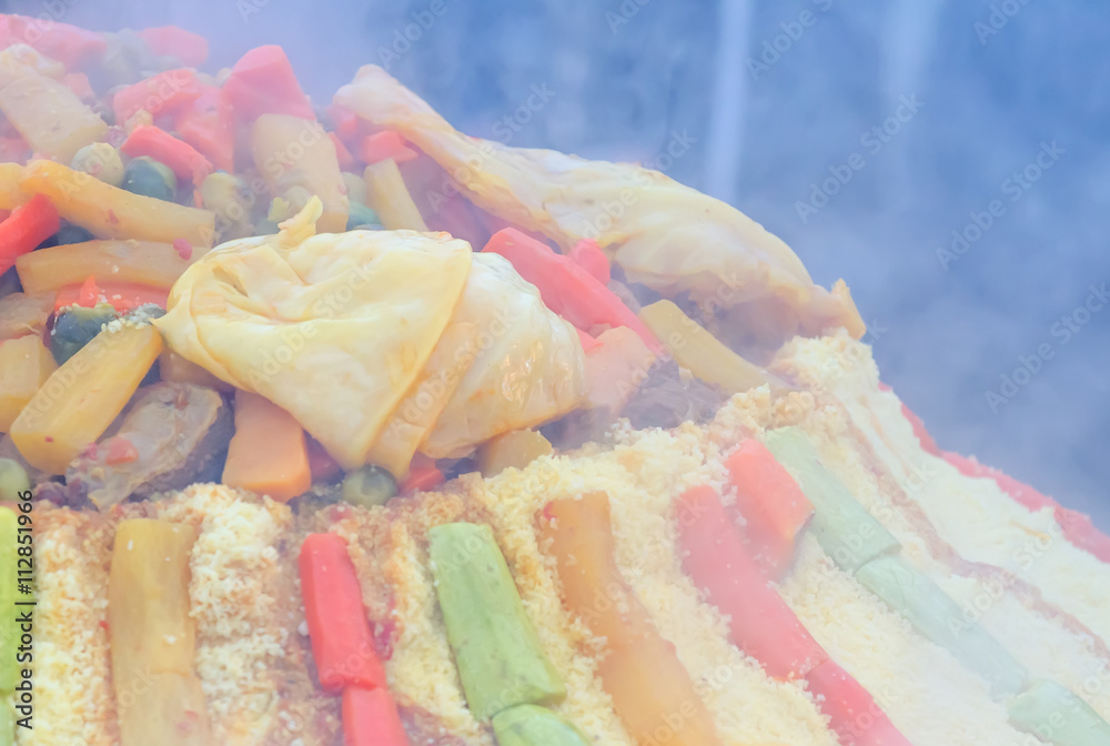 Preparation of a large couscous outdoors. Moroccan festival