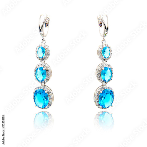 Pair of sapphire earrings isolated on white