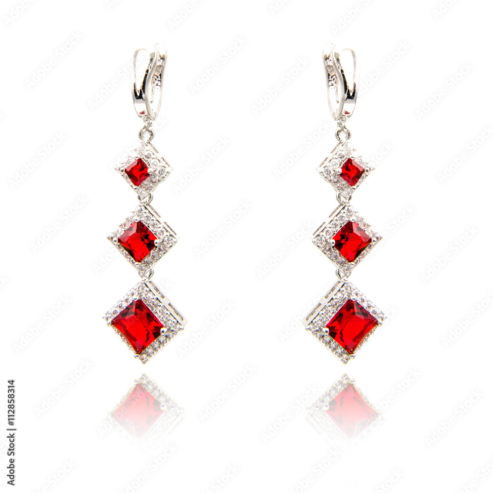 Pair of ruby diamond earrings isolated on white Pair of ruby diamond earrings isolated on white