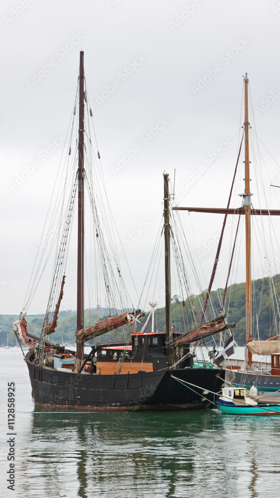 Traditional wooden sailing vessel moored in the river Fal in Cornwall 