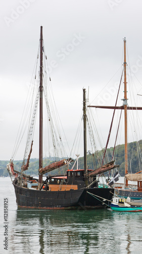 Traditional wooden sailing vessel moored in the river Fal in Cornwall 