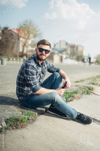 Man with gadget and glasses