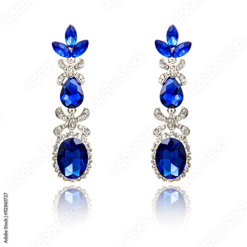 Pair of sapphire earrings isolated on white