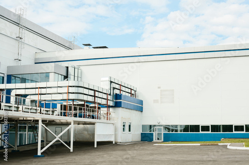 New modern hi-tech factory building with a cooling system. Workplaces. Employment.