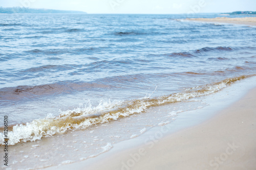 Waves. Sand. Sea. Outdoor recreation concept. Summer background.