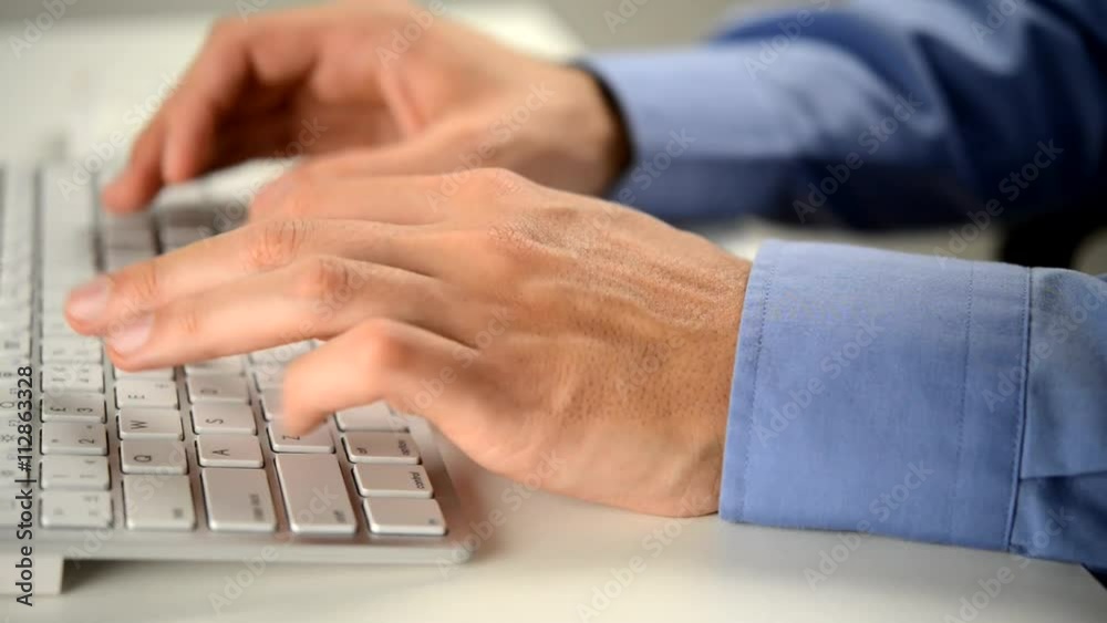 Businessman typing on a computer keyboard Businessman typing on a computer keyboard