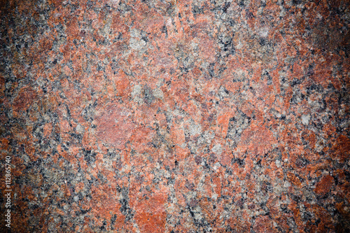 Stone Background of mottled red granite igneous rock © lumikk555