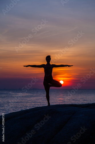 Yoga at sunset time