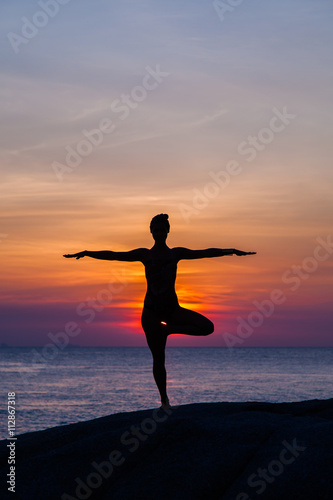 Yoga at sunset time