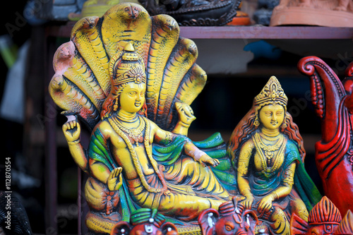 Colorful statue of hindu god Vishnu and Goddess Lakshmi photo