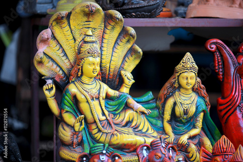 Bild auf Leinwand Colorful statue of hindu god Vishnu and Goddess Lakshmi