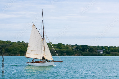 Small old gaff rig sailboat