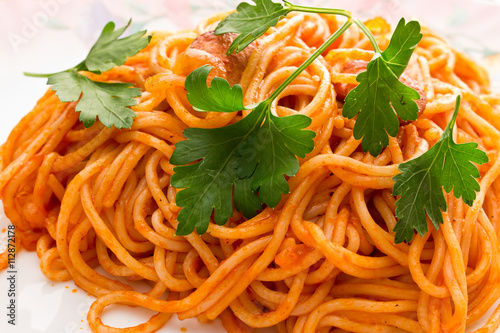 noodles in tomato sauce with parsley
