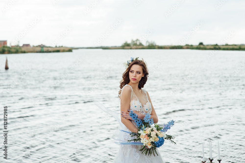 Beautiful young bride in luxury wedding dress