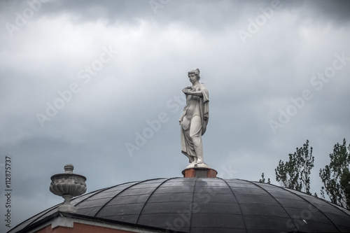 The woman's statue on the sky background photo