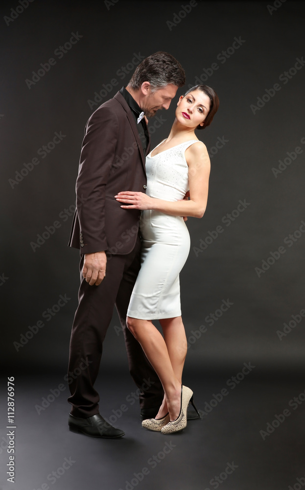 Happy mature couple on dark background Happy mature couple on dark background